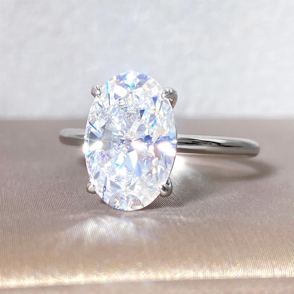 Bague de fiançailles avec halo d'émeraude ovale de laboratoire de 1 ct